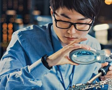 Man using magnifying glass