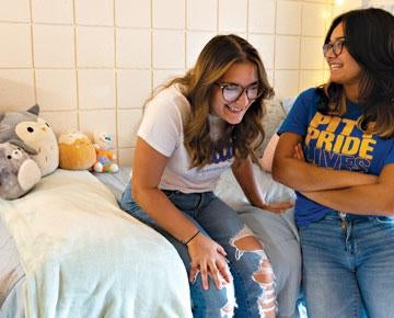 Students sitting in dorm
