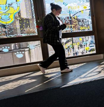 Student walking by window